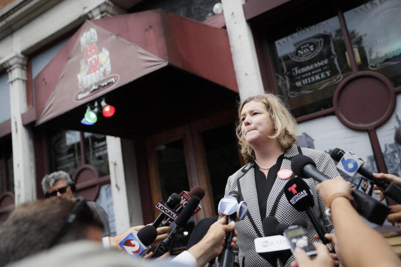 Dayton Mayor Nan Whaley speaks the media Tuesday, Aug. 6, 2019, outside Ned Peppers bar in the Oregon District following a mass shooting nearby on Aug. 4.